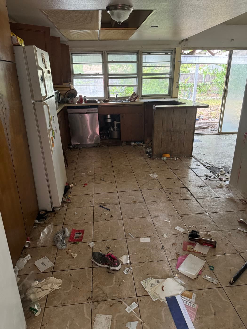 Trashed kitchen in a Garland house before demo