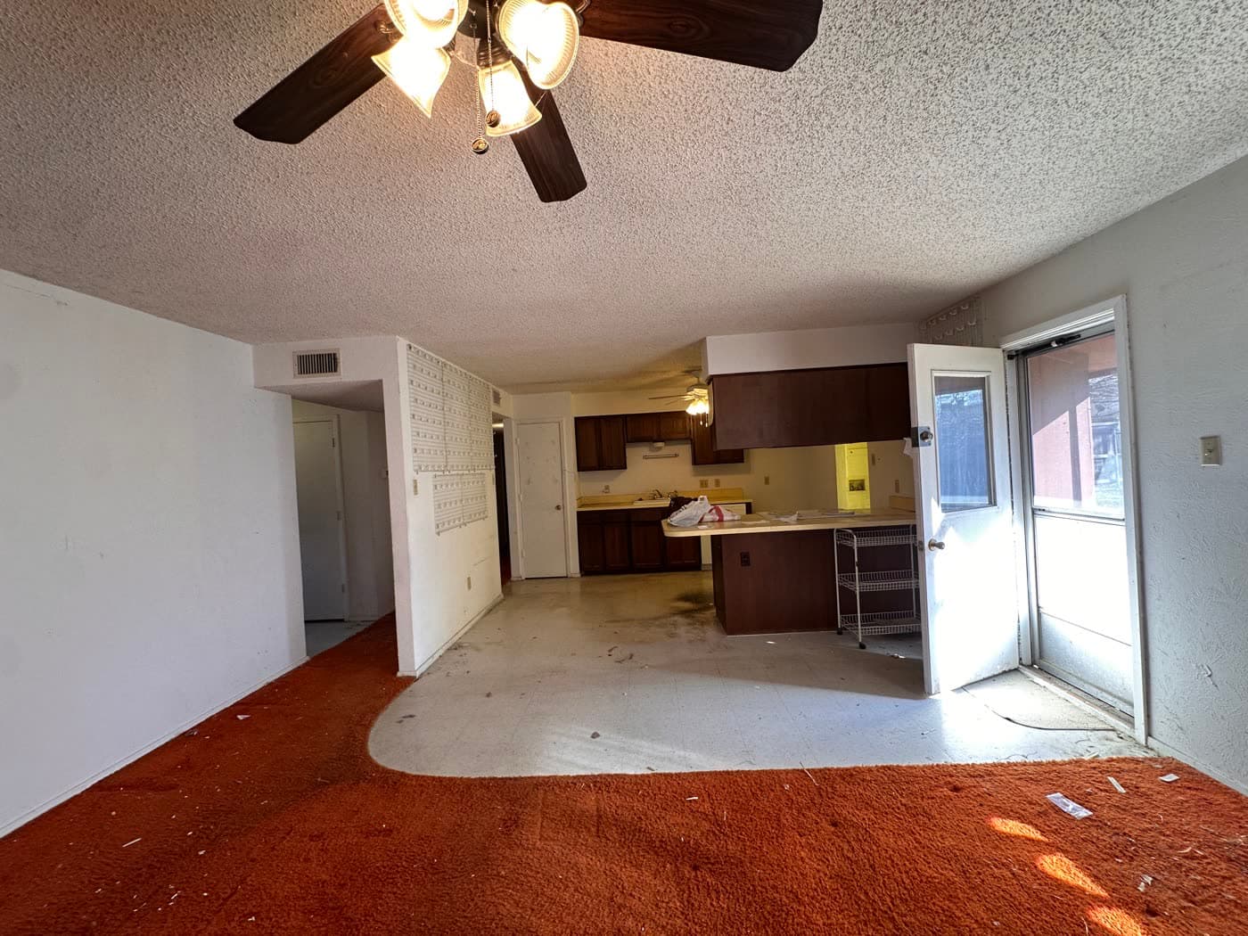 Dated kitchen and living room in Richardson